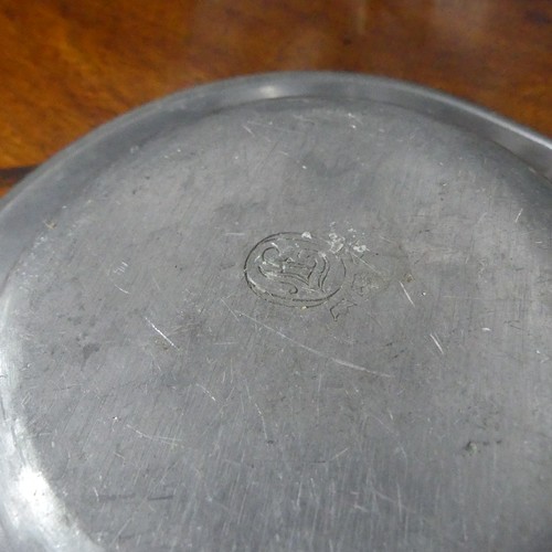 610 - A mid-18th century pewter Plate, with marking to reverse, including angel with sword and scales and ... 