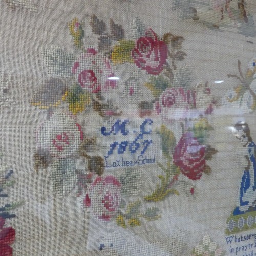 644 - A 19th century framed Embroidery, decorated with flora and fauna, ''M.C, 1867, Loxbear School'', W 7... 