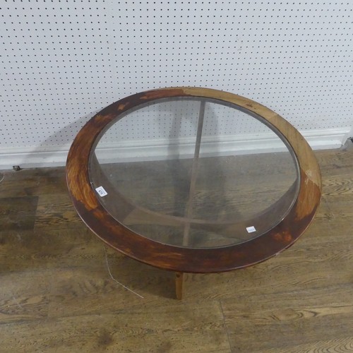 675 - A mid-20th century G-Plan Astro coffee Table, the circular teak top inset with glass, W 84 cm x H 45... 