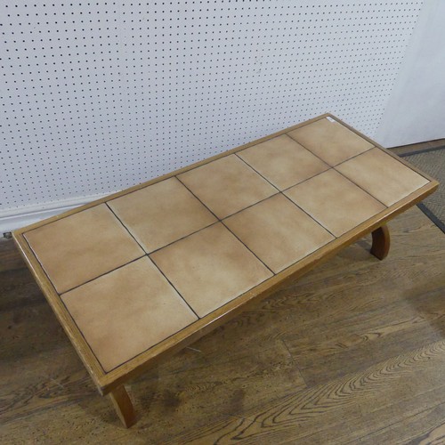 677 - A mid-20th century G-Plan tile-topped coffee Table, the rectangular top raised on 'X' shaped support... 