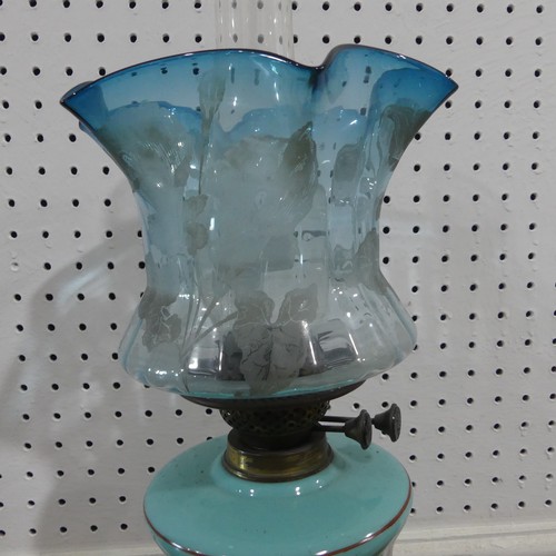 699 - A late Victorian blue glass Oil Lamp, with funnel and shade, H 56 cm.