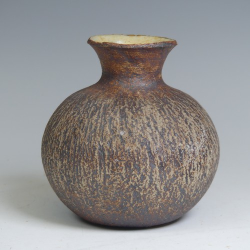 95 - Waistel Cooper (1921-2003); a squat stoneware vase with textured iron surface and glazed interior, p... 