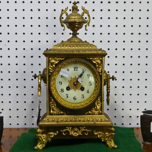 569 - A late 19th century French gilt metal mantle Clock, with a Japy Freres movement, gilt metal urn fini... 