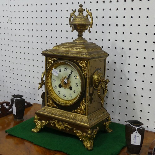 569 - A late 19th century French gilt metal mantle Clock, with a Japy Freres movement, gilt metal urn fini... 