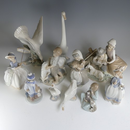 112 - A small quantity of Lladro, to comprise a figural group of a Boy and Girl reading amongst nature, H ... 