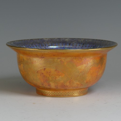 100 - Daisy Makeig-Jones for Wedgwood; a Dragon lustre Bowl, with mottled orange ground and overpainted gi... 