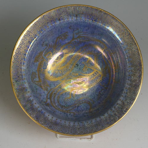 100 - Daisy Makeig-Jones for Wedgwood; a Dragon lustre Bowl, with mottled orange ground and overpainted gi... 