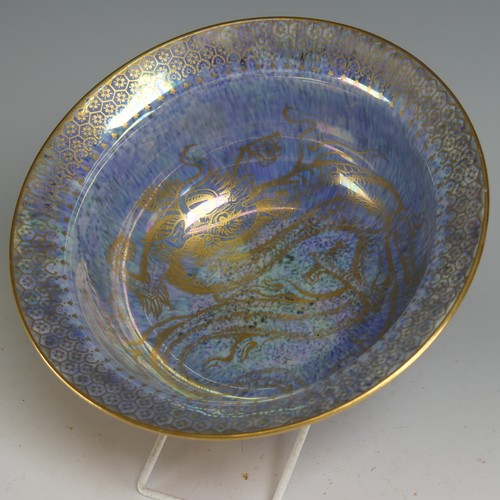 100 - Daisy Makeig-Jones for Wedgwood; a Dragon lustre Bowl, with mottled orange ground and overpainted gi... 