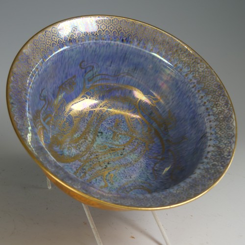 100 - Daisy Makeig-Jones for Wedgwood; a Dragon lustre Bowl, with mottled orange ground and overpainted gi... 