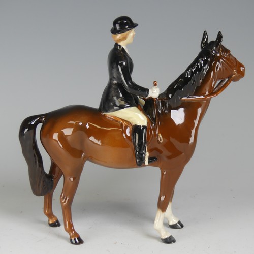 121 - A Beswick figure of a Huntswoman, no. 7130, on brown horse, factory marks to base, H cm.... 