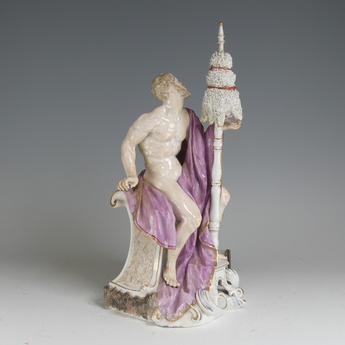 134 - A 19thC Continental porcelain Figure, of classical style, depicting a nude male draped in purple clo... 