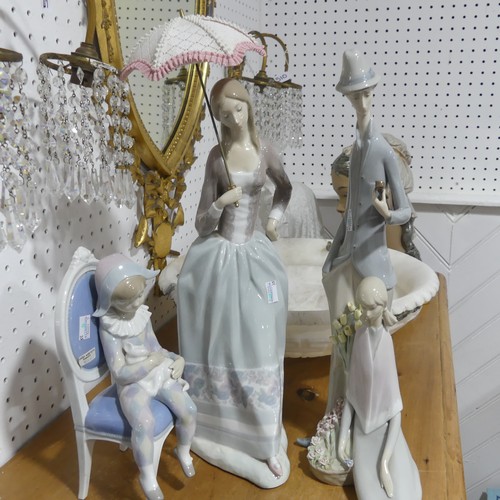 141 - A large Lladro figurine of lady with parasol, H 48cm, together with another large Lladro figurine of... 