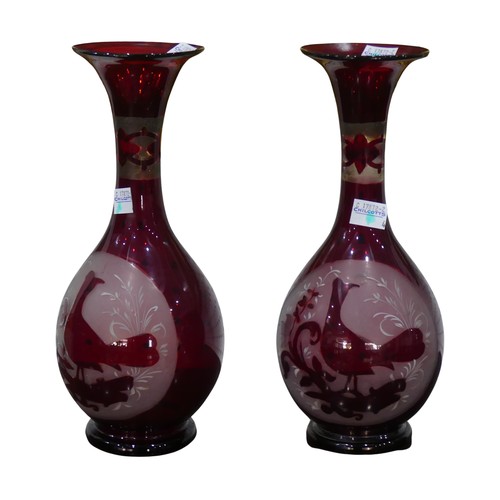 149 - A pair of large ruby flash baluster Vases, both decorated with a stylised bird amongst foliage, H 27... 