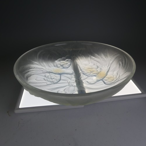 109 - A Jobling Lambton bird pattern opalescent glass Bowl, raised on three relief depictions of flying bi... 