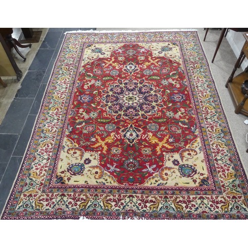 705 - Tribal Rugs; an antique Persian Ardebil carpet, the red ground woven with stylised exotic birds, ani... 