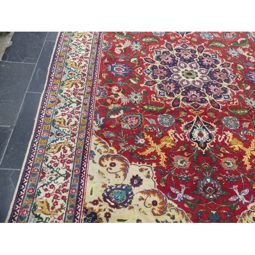 705 - Tribal Rugs; an antique Persian Ardebil carpet, the red ground woven with stylised exotic birds, ani... 