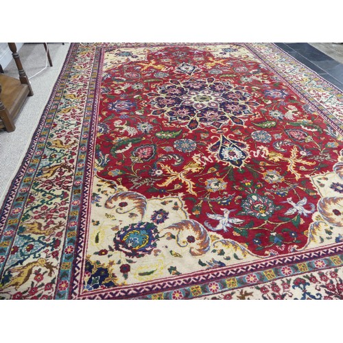 705 - Tribal Rugs; an antique Persian Ardebil carpet, the red ground woven with stylised exotic birds, ani... 