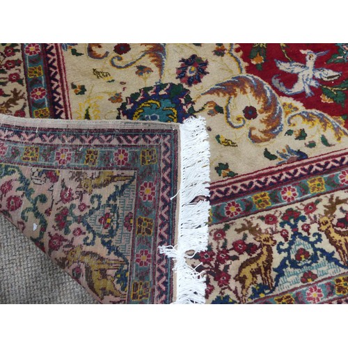 705 - Tribal Rugs; an antique Persian Ardebil carpet, the red ground woven with stylised exotic birds, ani... 