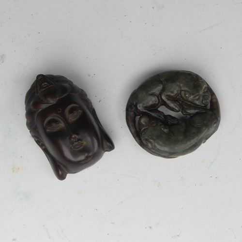 157 - A vintage spinach jade carving of two Dogs, modelled recumbent and lying head to tail, 4cm x 4.5cm, ... 