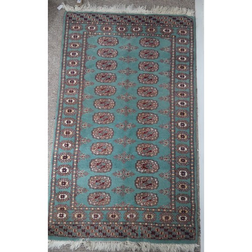 708 - Tribal Rugs: a green ground Bokhara rug, wool pile on a cotton base, good condition, 140cm x 79cm.... 