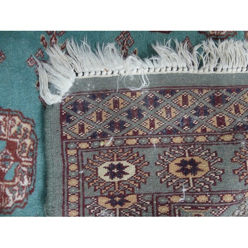 708 - Tribal Rugs: a green ground Bokhara rug, wool pile on a cotton base, good condition, 140cm x 79cm.... 