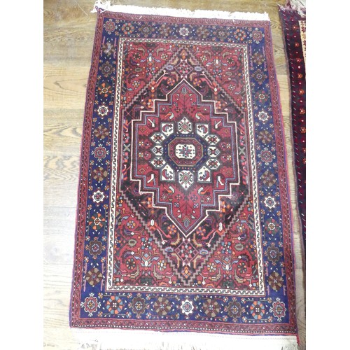 709 - Tribal Rugs: a red ground Belouchi Prayer Rug, 100% wool, 150cm x 86cm, together with a Persian Zanj... 