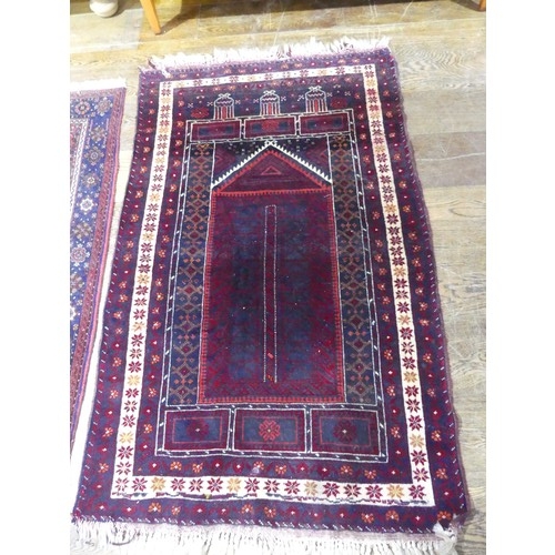 709 - Tribal Rugs: a red ground Belouchi Prayer Rug, 100% wool, 150cm x 86cm, together with a Persian Zanj... 