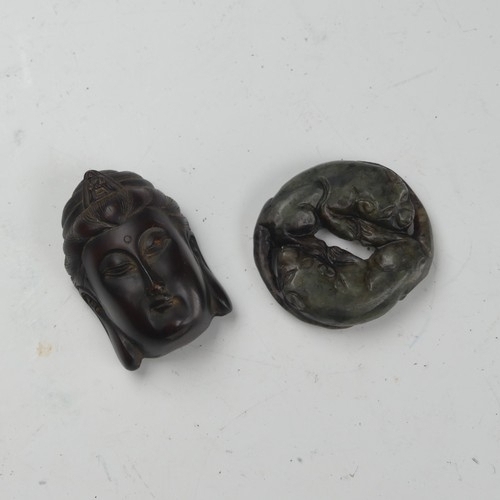 157 - A vintage spinach jade carving of two Dogs, modelled recumbent and lying head to tail, 4cm x 4.5cm, ... 