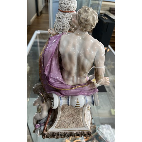 134 - A 19thC Continental porcelain Figure, of classical style, depicting a nude male draped in purple clo... 