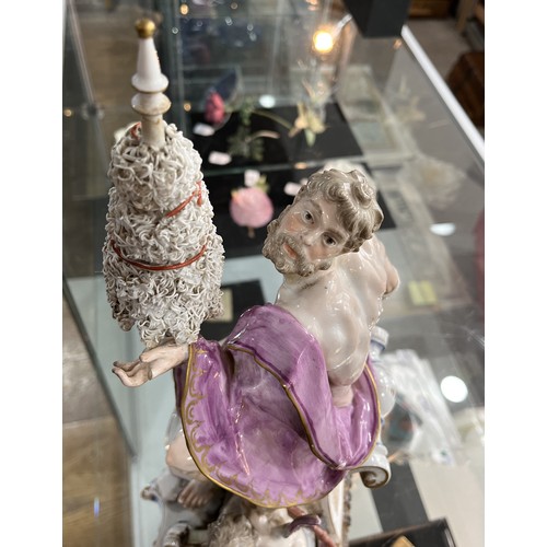 134 - A 19thC Continental porcelain Figure, of classical style, depicting a nude male draped in purple clo... 