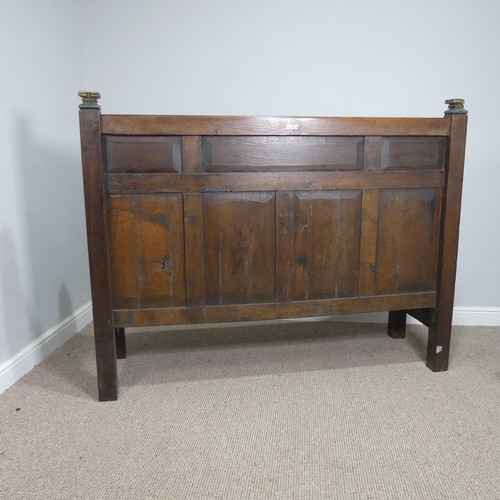 504 - An 18th century style carved oak Settle, the top with carved panels depicting foliate scrolls and he... 