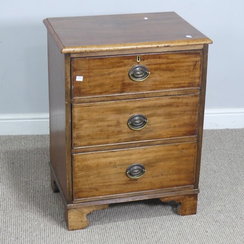 505 - An Edwardian mahogany bedside Chest of drawers, with three drawers raised on bracket feet, W 56.5 cm... 