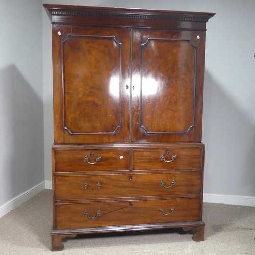 509 - A Georgian flame mahogany Linen Press, the moulded cornice over cupboard drawers concealing slides, ... 