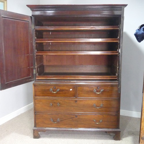 509 - A Georgian flame mahogany Linen Press, the moulded cornice over cupboard drawers concealing slides, ... 