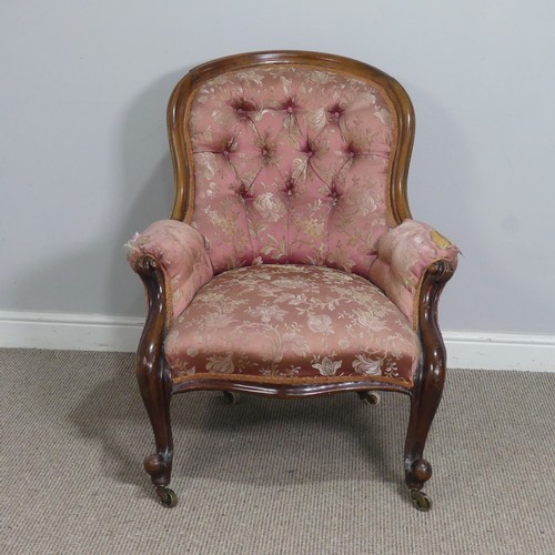 510 - A Victorian mahogany show-frame button-back Armchair, the arched top over serpentine front seat, fla... 