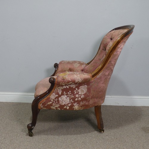 510 - A Victorian mahogany show-frame button-back Armchair, the arched top over serpentine front seat, fla... 