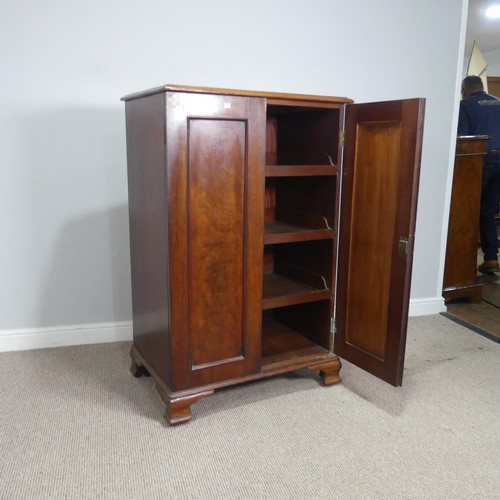 512 - A 19thC flame mahogany Linen Press/Cupboard, of small proportions, two cupboard doors concealing thr... 