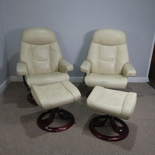 520 - A pair of stressless cream leather Armchairs, both with footstools, (armchairs) W 83 cm x H  107 cm ... 