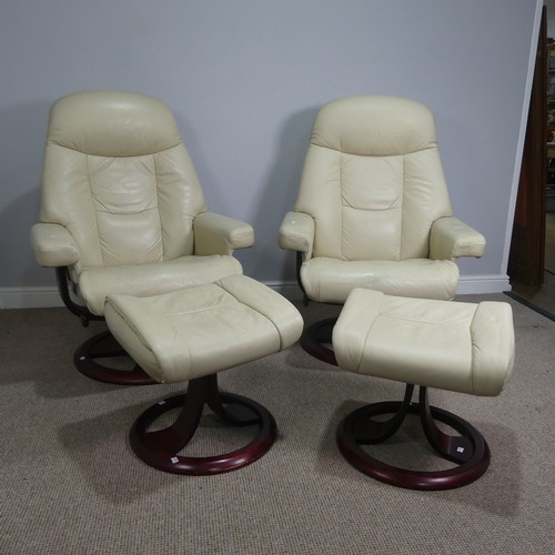 520 - A pair of stressless cream leather Armchairs, both with footstools, (armchairs) W 83 cm x H  107 cm ... 