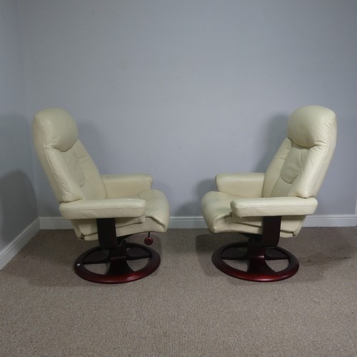 520 - A pair of stressless cream leather Armchairs, both with footstools, (armchairs) W 83 cm x H  107 cm ... 