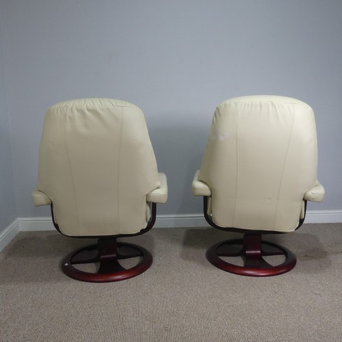 520 - A pair of stressless cream leather Armchairs, both with footstools, (armchairs) W 83 cm x H  107 cm ... 