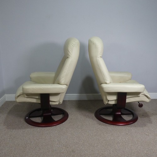 520 - A pair of stressless cream leather Armchairs, both with footstools, (armchairs) W 83 cm x H  107 cm ... 