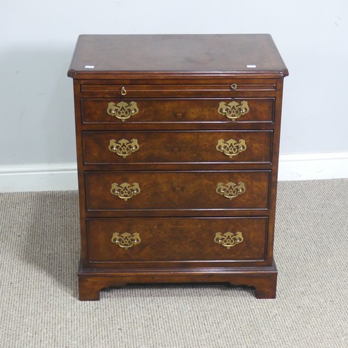 521 - A small reproduction burr walnut and mahogany Chest of drawers, with brushing slide over four gradua... 