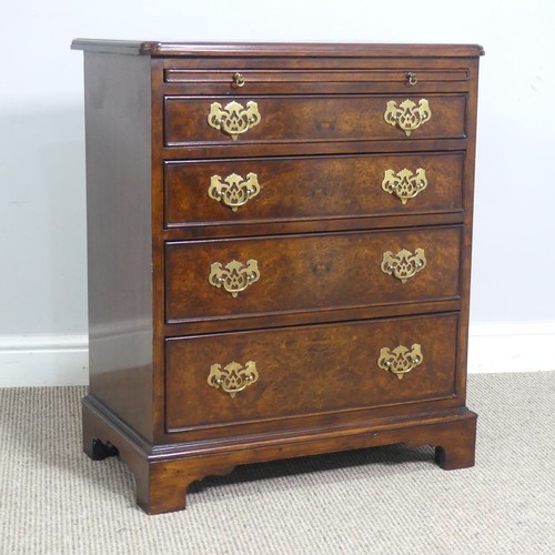 521 - A small reproduction burr walnut and mahogany Chest of drawers, with brushing slide over four gradua... 