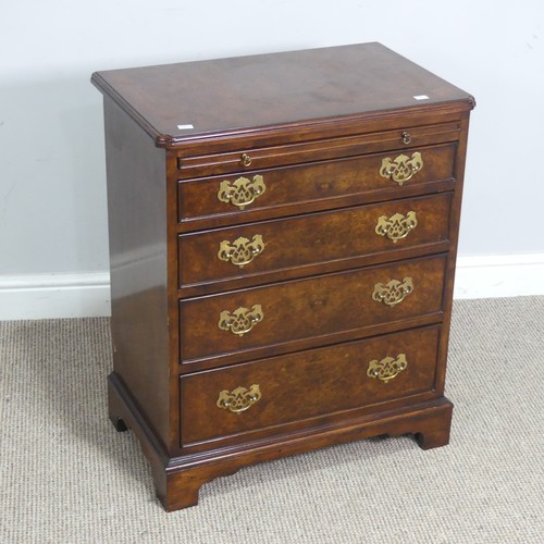 521 - A small reproduction burr walnut and mahogany Chest of drawers, with brushing slide over four gradua... 