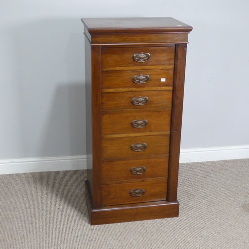 528 - An Edwardian oak Wellington Chest of seven drawers, the drawers mounted with Arts and Crafts style c... 