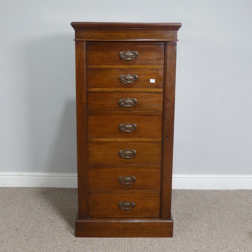 528 - An Edwardian oak Wellington Chest of seven drawers, the drawers mounted with Arts and Crafts style c... 