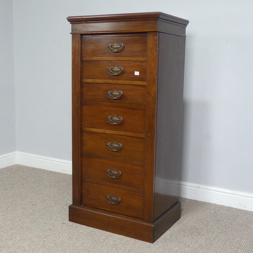 528 - An Edwardian oak Wellington Chest of seven drawers, the drawers mounted with Arts and Crafts style c... 