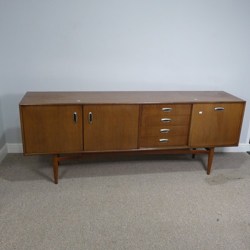 530 - A mid-20th century G-plan teak Sideboard, by E. Gomme, comprising of three cupboards ad four drawers... 