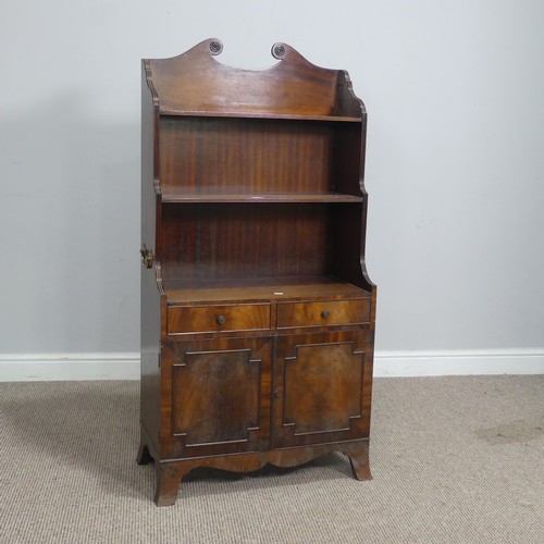 564 - A regency style mahogany open waterfall Bookcase, the scrolled pediment over shelves, drawers and cu... 